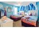 Two twin beds with Frozen-themed bedding and decor at 4209 Paragraph Dr, Kissimmee, FL 34746
