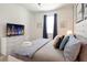 Spacious bedroom with a large bed, dresser, and TV at 4209 Paragraph Dr, Kissimmee, FL 34746