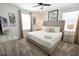 King-size bed, neutral decor, and a TV at 4209 Paragraph Dr, Kissimmee, FL 34746