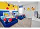 Two twin beds, Pokemon-themed decor, and a TV at 4209 Paragraph Dr, Kissimmee, FL 34746