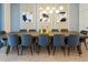 Dining room with large table and blue chairs at 4209 Paragraph Dr, Kissimmee, FL 34746