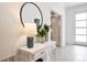 Bright entryway with white console table, mirror, and decor at 4209 Paragraph Dr, Kissimmee, FL 34746