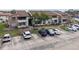 Condo building with parking and landscaping at 4605 Cason Cove Dr # 121, Orlando, FL 32811