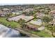 Community pool and tennis courts with surrounding landscaping at 4605 Cason Cove Dr # 121, Orlando, FL 32811