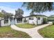 Pathway to detached garage and screened porch at 505 Sir Arthur Ct, Apopka, FL 32712