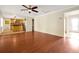 Open living room with hardwood floors and access to kitchen at 5533 Westbury Dr, Orlando, FL 32808