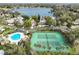 Community pool and tennis courts overlook a lake at 600 Torrey Oaks Ct, Longwood, FL 32750