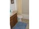 Bathroom with beige tile floor, a shower/tub combo, and wood vanity at 603 Keppel Ct, Kissimmee, FL 34746