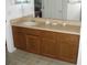 Clean bathroom with a vanity, sink, and wood cabinets at 603 Keppel Ct, Kissimmee, FL 34746