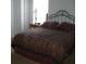 Bright bedroom with a double bed, nightstand, and ample closet space at 603 Keppel Ct, Kissimmee, FL 34746