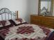 Serene bedroom with a full bed and matching dresser at 603 Keppel Ct, Kissimmee, FL 34746