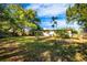 Large backyard with mature trees and grassy area at 6150 Medford Dr, Orlando, FL 32808
