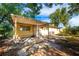 Home's backyard with covered patio and spacious yard at 6150 Medford Dr, Orlando, FL 32808