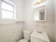 Clean bathroom with white vanity and a large mirror at 6150 Medford Dr, Orlando, FL 32808