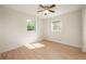 Spacious bedroom with two windows and light flooring at 6150 Medford Dr, Orlando, FL 32808