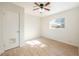 Simple bedroom with ceiling fan and wood-look floors at 6150 Medford Dr, Orlando, FL 32808