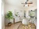 A well lit dining area with a glass table and four chairs at 6150 Medford Dr, Orlando, FL 32808