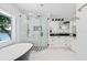 Elegant bathroom featuring a walk-in shower and double vanity at 6517 Cay Cir, Belle Isle, FL 32809