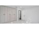 Spacious bedroom closet with light wood doors and multiple drawers at 6517 Cay Cir, Belle Isle, FL 32809