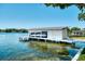 Private boat house with lift and covered dock on the lake at 6517 Cay Cir, Belle Isle, FL 32809