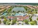 An aerial view of the clubhouse, community pool, lazy river, splashpad, and lake at 8824 Bengal Ct, Kissimmee, FL 34747