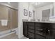 Bathroom with granite countertop and walk-in shower at 8824 Bengal Ct, Kissimmee, FL 34747