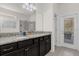 Double vanity bathroom with granite countertop and walk-in shower at 8824 Bengal Ct, Kissimmee, FL 34747