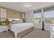 King-size bed in a well-lit bedroom with decor at 8824 Bengal Ct, Kissimmee, FL 34747
