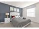 Bedroom with queen bed and cow print bedding at 8824 Bengal Ct, Kissimmee, FL 34747