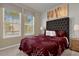 Spacious bedroom with large windows and comfortable bed at 8824 Bengal Ct, Kissimmee, FL 34747