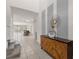 Bright entryway with modern console table and staircase at 8824 Bengal Ct, Kissimmee, FL 34747