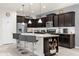 Modern kitchen with dark cabinets and island at 8824 Bengal Ct, Kissimmee, FL 34747