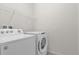 Bright laundry room with Whirlpool washer and dryer at 8824 Bengal Ct, Kissimmee, FL 34747