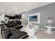 Living area with sectional sofa and wall-mounted TV at 8824 Bengal Ct, Kissimmee, FL 34747