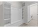 Mud room with built-in shelving and access to the laundry room at 8824 Bengal Ct, Kissimmee, FL 34747