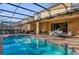 Relaxing pool area with covered patio and spa at 8824 Bengal Ct, Kissimmee, FL 34747