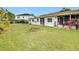Spacious backyard with green grass and home view at 936 Gillingham Ct, Kissimmee, FL 34758