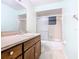 Clean bathroom with a shower/tub combo and wood vanity at 936 Gillingham Ct, Kissimmee, FL 34758