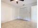Simple bedroom with tile floors and a large closet at 936 Gillingham Ct, Kissimmee, FL 34758