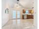 Kitchen with wood cabinets, granite countertops and tile floors at 936 Gillingham Ct, Kissimmee, FL 34758