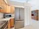 Kitchen boasts wood cabinets, granite counters & modern appliances at 936 Gillingham Ct, Kissimmee, FL 34758