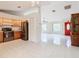 Open kitchen layout with a view of the living room and red front door at 936 Gillingham Ct, Kissimmee, FL 34758