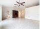 Living room with tile floors, ceiling fan and built-in hutch at 936 Gillingham Ct, Kissimmee, FL 34758