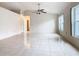 Spacious living room featuring tile floors and ample natural light at 936 Gillingham Ct, Kissimmee, FL 34758