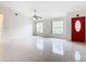 Living area with tile floors and a red door at 936 Gillingham Ct, Kissimmee, FL 34758