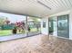 Covered patio with tile floor and sliding glass door access at 936 Gillingham Ct, Kissimmee, FL 34758
