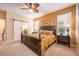 King-size bed, nightstands, and a ceiling fan in the bedroom at 9427 Komika Ln, Winter Garden, FL 34787