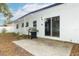 Backyard patio with grill and access to the house at 992 Carnation Dr, Winter Park, FL 32792