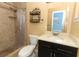 Updated bathroom with tiled shower and vanity with dark cabinets at 992 Carnation Dr, Winter Park, FL 32792