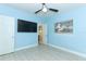 Light blue bedroom with wood-look floors, large closet and en-suite bathroom at 992 Carnation Dr, Winter Park, FL 32792